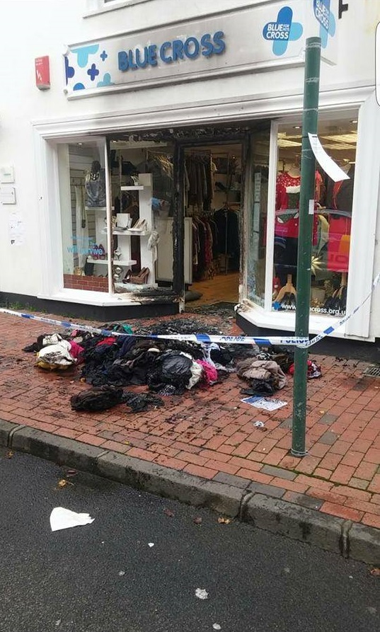 The debris from the fire lay outside the shop until emergency services could clean up the area.